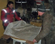 Douglas and Loughie begin to cut out sail fabric. Photo: SR